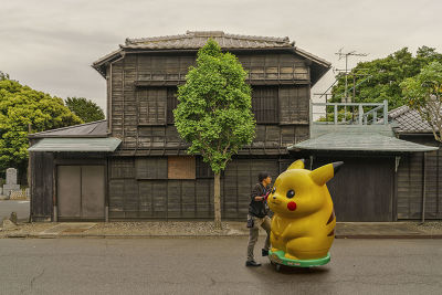 JAPAN - MAN PUSHING A BIG PIKACHU
